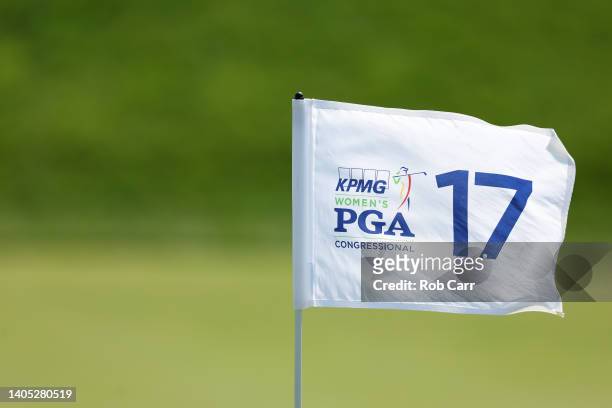 The flag blows in the breeze on the 17th green during the final round of the KPMG Women's PGA Championship at Congressional Country Club on June 26,...