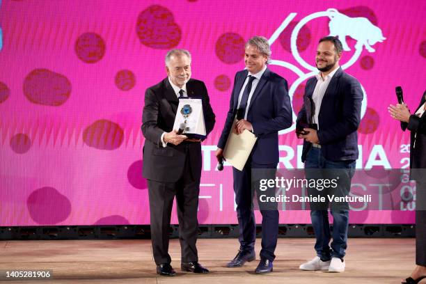 Director Francis Ford Coppola Savoca Mayor Antonino Bartolotta, and a guest are seen on stage during the Taormina Film Fest 2022 Opening Ceremony on...