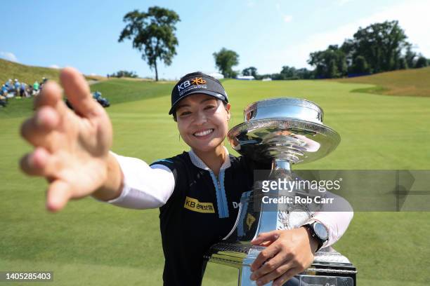 In Gee Chun of South Korea imitates a selfie while holding the championship trophy after winning during the final round of the KPMG Women's PGA...