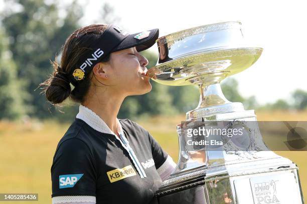 In Gee Chun of South Korea kisses the championship trophy after winning during the final round of the KPMG Women's PGA Championship at Congressional...
