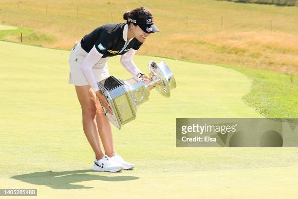 In Gee Chun of South Korea bows while holding the championship trophy after winning during the final round of the KPMG Women's PGA Championship at...