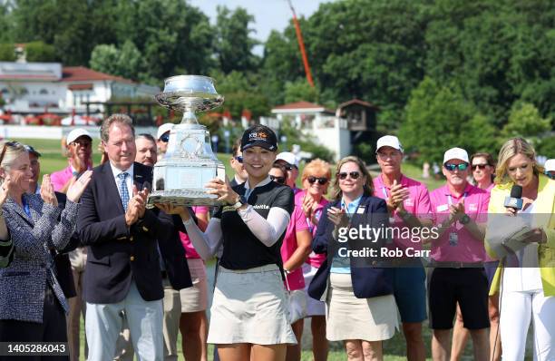 In Gee Chun of South Korea poses with the championship trophy during the presentation ceremony after winning during the final round of the KPMG...