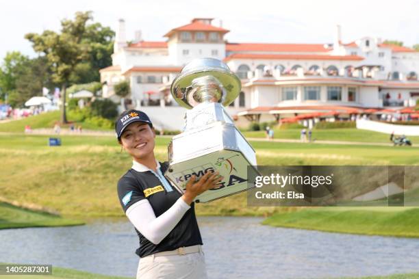 In Gee Chun of South Korea celebrates with the championship trophy after winning during the final round of the KPMG Women's PGA Championship at...