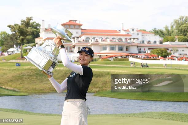 In Gee Chun of South Korea celebrates with the championship trophy after winning during the final round of the KPMG Women's PGA Championship at...