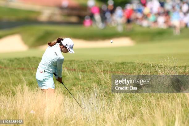 Lydia Ko of New Zealand plays an approach shot on the 18th hole during the final round of the KPMG Women's PGA Championship at Congressional Country...