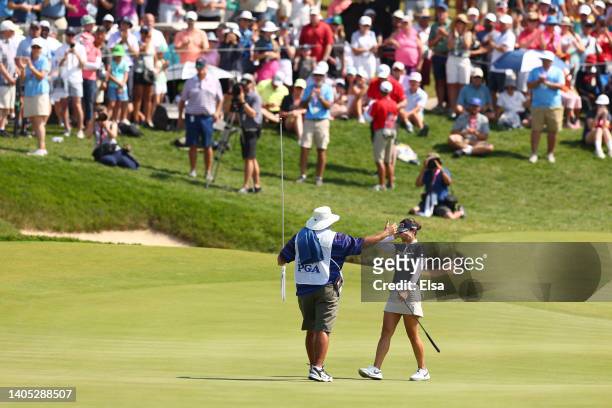 In Gee Chun of South Korea celebrates with caddie Dean Herden after winning on the 18th green during the final round of the KPMG Women's PGA...