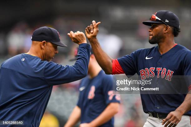 Manager Alex Cora and Franchy Cordero of the Boston Red Sox celebrate the team's 8-3 win over the Cleveland Guardians at Progressive Field on June...