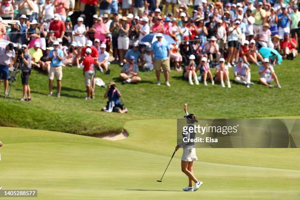 In Gee Chun of South Korea waves after making her putt for par on the 18th green to win during the final round of the KPMG Women's PGA Championship...