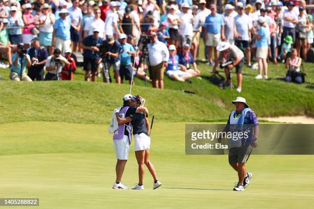 Lexi Thompson of the United States and her caddie Will Davidson hug on the 18th green during the final round of the KPMG Women's PGA Championship at...
