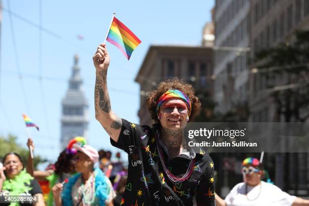 Marcher holds a Pride flag during the 52nd Annual San Francisco Pride Parade and Celebration on June 26, 2022 in San Francisco, California. Thousands...