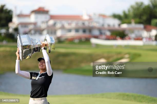 In Gee Chun of South Korea celebrates with the championship trophy after winning during the final round of the KPMG Women's PGA Championship at...