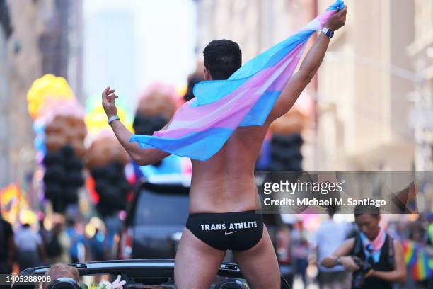 Schuyler Bailar, the first transgender athlete to compete in any sport on an NCAA Division I men’s team and NYC Pride grand marshal, waves as he...
