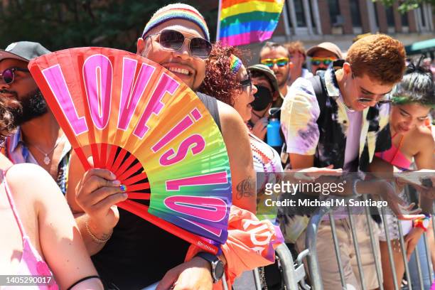 People watch the New York City Pride Parade on Fifth Avenue on June 26, 2022 in New York City. The 53rd annual NYC Pride March is the marquee event...
