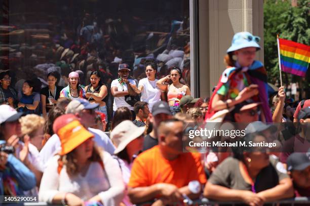 People watch the New York City Pride Parade on Fifth Avenue on June 26, 2022 in New York City. The 53rd annual NYC Pride March is the marquee event...