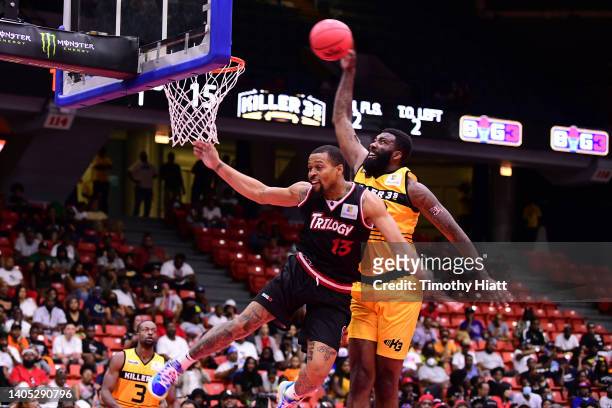 Donte Green of the Killer 3's dunks against Isaiah Briscoe of the Trilogy during BIG3 Week Two at Credit Union 1 Arena on June 26, 2022 in Chicago,...