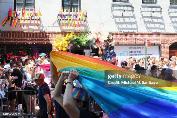 People participate in the New York City Pride Parade on Christopher Street on June 26, 2022 in New York City. The 53rd annual NYC Pride March is the...