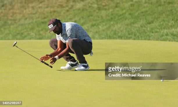 Sahith Theegala of the United States reacts to a missed bogie putt on the 18th green during the final round of Travelers Championship at TPC River...
