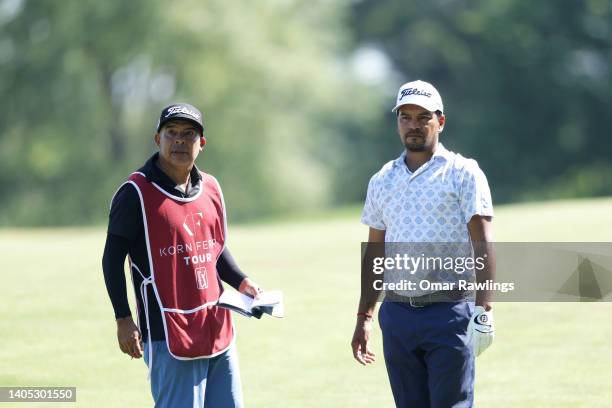 Fabián Gómez of Argentina and his caddie talk on the 15th fairway during the final round of the Live and Work in Maine Open at Falmouth Country Club...