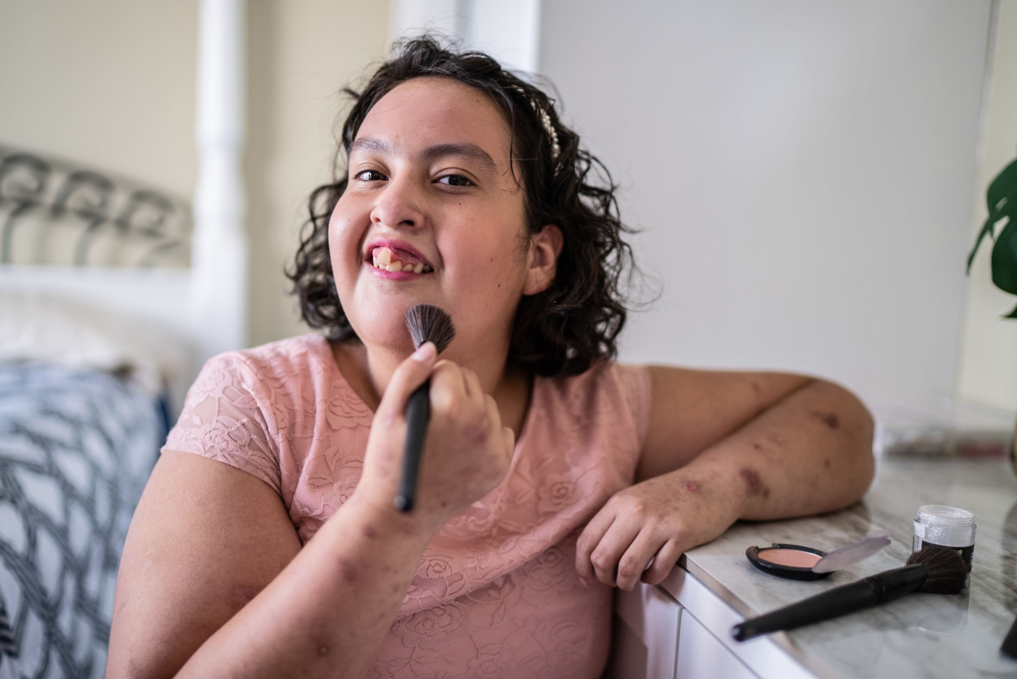 Psychomotor Intellectual disability girl doing her makeup at home Psychomotor Intellectual disability girl doing her makeup at home