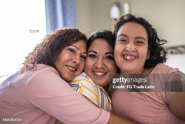 portrait of mother and daughter at home - including a psychomotor retardation girl - chubby granny stock pictures, royalty-free photos & images