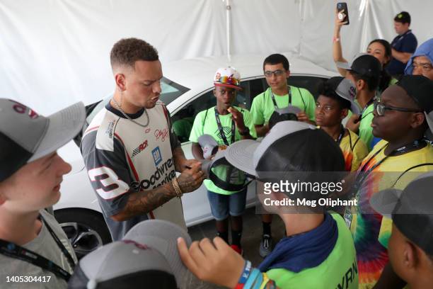 Singer Kane Brown meets with members of the Boys & Girls Clubs of America in the garage area = prior to the prior to the NASCAR Cup Series Ally 400...