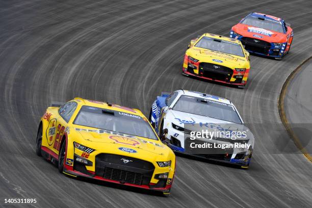 Joey Logano, driver of the Shell Pennzoil Ford, Ricky Stenhouse Jr., driver of the Kroger/Entenmann's Chevrolet, Michael McDowell, driver of the...