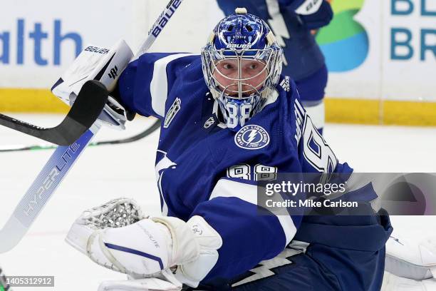 Andrei Vasilevskiy of the Tampa Bay Lightning stretches to block a shot on goal in the first period in Game Six of the 2022 NHL Stanley Cup Final...