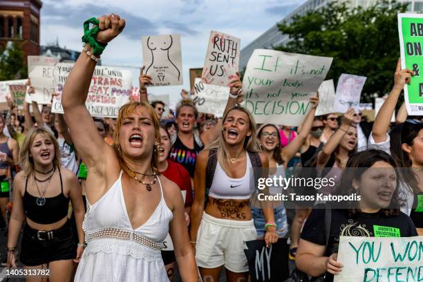 Julianne D’Eredita marches with other protesters to the White House to denounce the U.S. Supreme Court decision to end federal abortion rights...