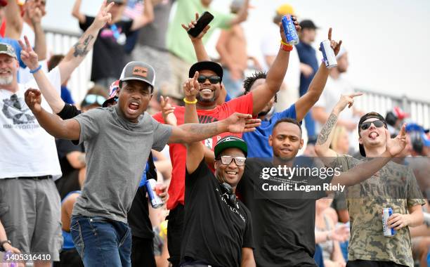 Fans pose or a photo during the NASCAR Cup Series Ally 400 at Nashville Superspeedway on June 26, 2022 in Lebanon, Tennessee.