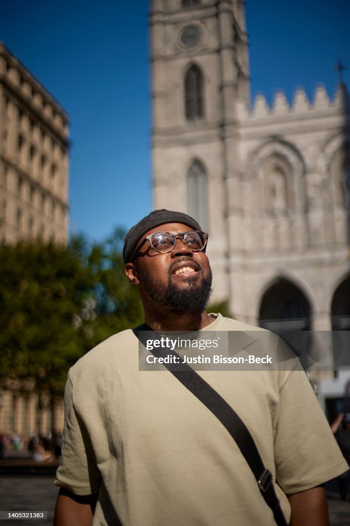 Young man visiting Notre Dame Church in Montreal