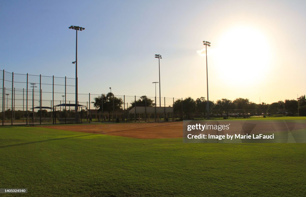 Empty baseball diamond at dusk