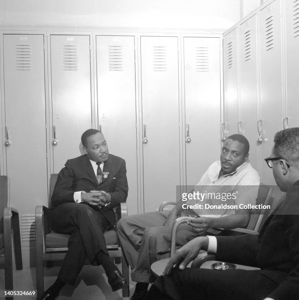 Reverend Dr Martin Luther King and lawyer Chauncey Eskridge visit comedian and civil rights activist Dick Gregory in jail after his arrest during a...