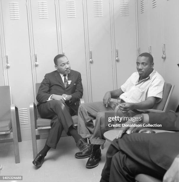 Reverend Dr Martin Luther King and lawyer Chauncey Eskridge visit comedian and civil rights activist Dick Gregory in jail after his arrest during a...