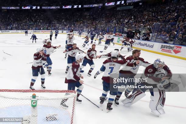 Colorado Avalanche players celebrate after defeating the Tampa Bay Lightning 2-1 in Game Six of the 2022 NHL Stanley Cup Final at Amalie Arena on...