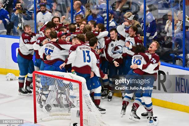 Colorado Avalanche players celebrate after defeating the Tampa Bay Lightning 2-1 in Game Six of the 2022 NHL Stanley Cup Final at Amalie Arena on...