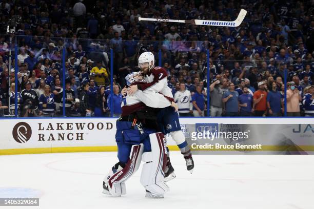 Darcy Kuemper and Devon Toews of the Colorado Avalanche celebrate after defeating the Tampa Bay Lightning 2-1 in Game Six of the 2022 NHL Stanley Cup...