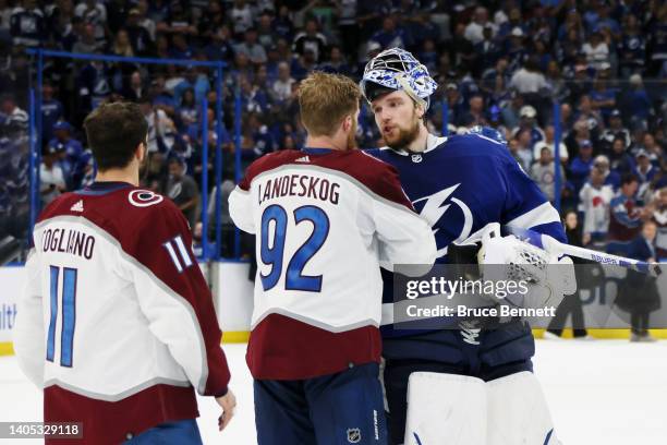 Gabriel Landeskog of the Colorado Avalanche shakes hands with Andrei Vasilevskiy of the Tampa Bay Lightning after defeating the Tampa Bay Lightning...