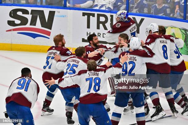 Colorado Avalanche players celebrate after defeating the Tampa Bay Lightning 2-1 in Game Six of the 2022 NHL Stanley Cup Final at Amalie Arena on...