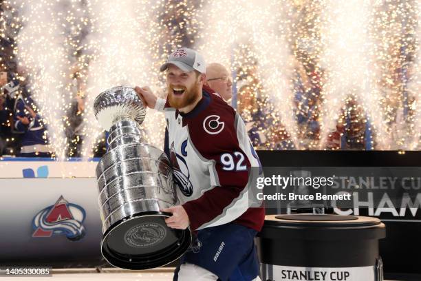 Gabriel Landeskog of the Colorado Avalanche lifts the Stanley Cup after defeating the Tampa Bay Lightning 2-1 in Game Six of the 2022 NHL Stanley Cup...