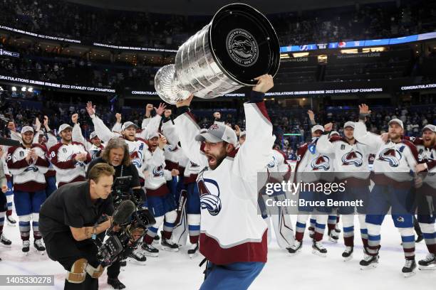 Andrew Cogliano of the Colorado Avalanche lifts the Stanley Cup after defeating the Tampa Bay Lightning 2-1 in Game Six of the 2022 NHL Stanley Cup...