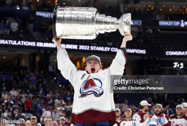Bowen Byram of the Colorado Avalanche lifts the Stanley Cup after defeating the Tampa Bay Lightning 2-1 in Game Six of the 2022 NHL Stanley Cup Final...