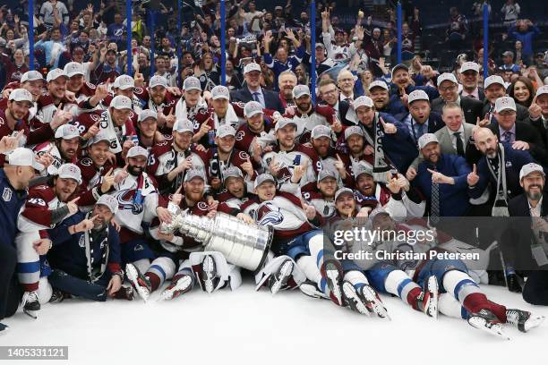 Colorado Avalanche coaches and players pose for a photo after defeating the Tampa Bay Lightning 2-1 in Game Six of the 2022 NHL Stanley Cup Final at...