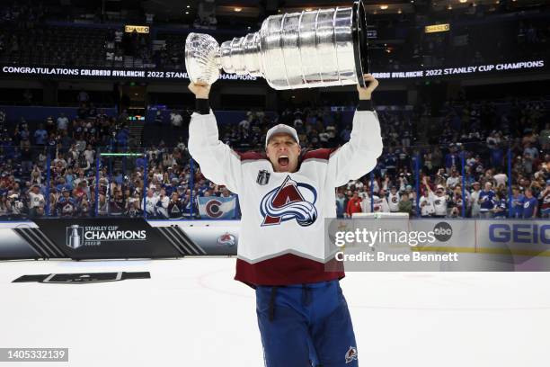 Jack Johnson of the Colorado Avalanche lifts the Stanley Cup after defeating the Tampa Bay Lightning 2-1 in Game Six of the 2022 NHL Stanley Cup...