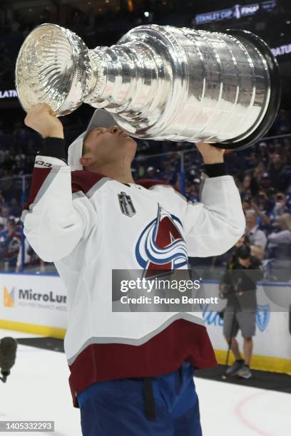 Jack Johnson of the Colorado Avalanche lifts the Stanley Cup after defeating the Tampa Bay Lightning 2-1 in Game Six of the 2022 NHL Stanley Cup...