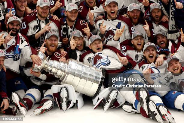 Colorado Avalanche coaches and players pose for a photo after defeating the Tampa Bay Lightning 2-1 in Game Six of the 2022 NHL Stanley Cup Final at...