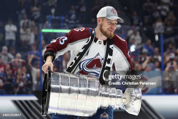 Valeri Nichushkin of the Colorado Avalanche lifts the Stanley Cup after defeating the Tampa Bay Lightning 2-1 in Game Six of the 2022 NHL Stanley Cup...