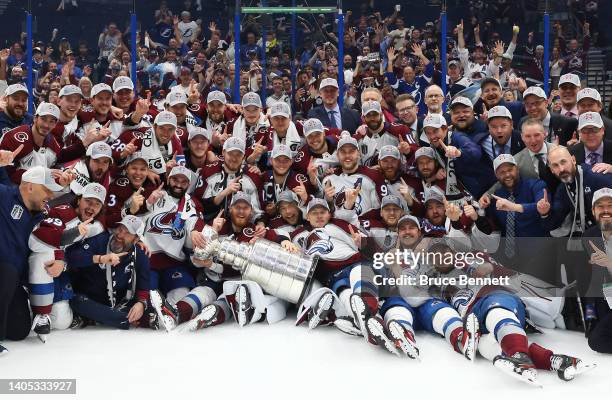 Colorado Avalanche coaches and players pose for a photo after defeating the Tampa Bay Lightning 2-1 in Game Six of the 2022 NHL Stanley Cup Final at...