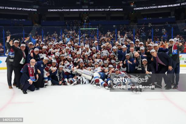 Colorado Avalanche coaches and players pose for a photo after defeating the Tampa Bay Lightning 2-1 in Game Six of the 2022 NHL Stanley Cup Final at...