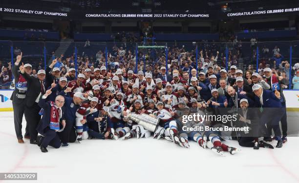 Colorado Avalanche coaches and players pose for a photo after defeating the Tampa Bay Lightning 2-1 in Game Six of the 2022 NHL Stanley Cup Final at...