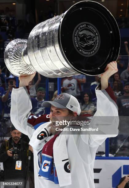 Artturi Lehkonen of the Colorado Avalanche hoists the Stanley Cup after the Colorado Avalanche defeated the Tampa Bay Lightning in Game Six of the...